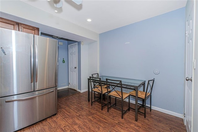 kitchen with baseboards, freestanding refrigerator, and dark wood finished floors