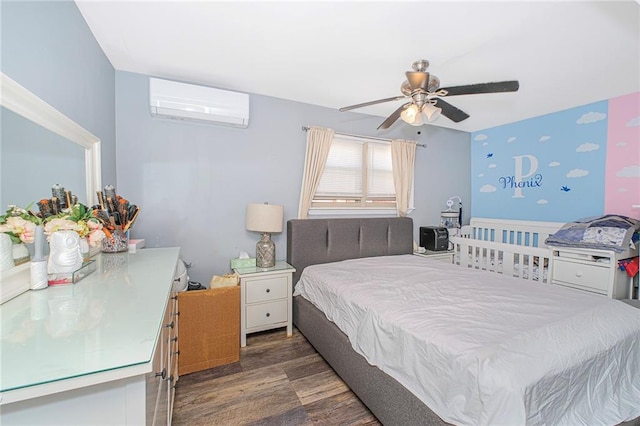 bedroom featuring ceiling fan, a wall mounted AC, and wood finished floors