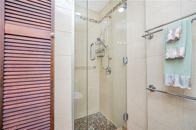 full bath featuring a shower stall