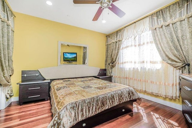 bedroom with recessed lighting, baseboards, a ceiling fan, and wood finished floors