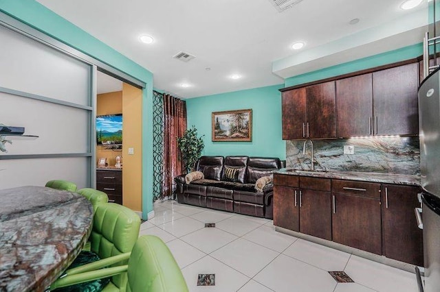 interior space featuring visible vents, recessed lighting, and light tile patterned floors