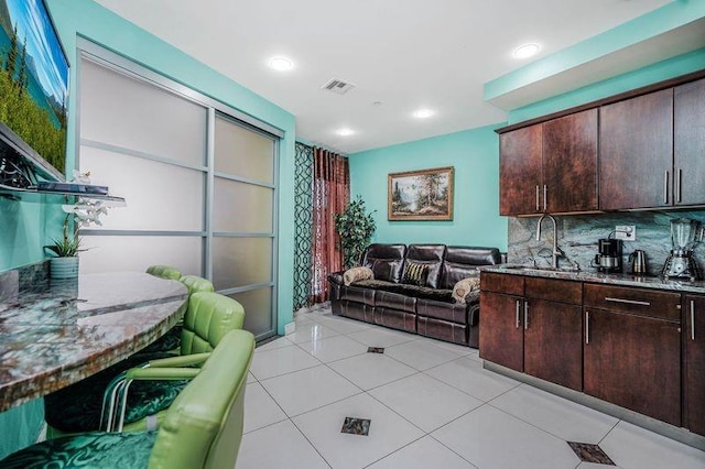 living room featuring visible vents, recessed lighting, and light tile patterned floors