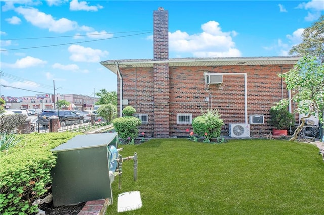 1960 Stillwell Ave, Brooklyn, NY 11223 - view of property exterior featuring brick siding, a yard, and a chimney
