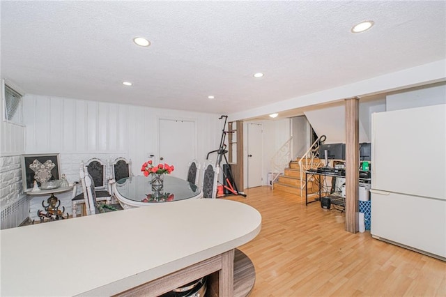 1960 Stillwell Ave, Brooklyn, NY 11223 - dining area with stairway, light wood-style flooring, a textured ceiling, and recessed lighting