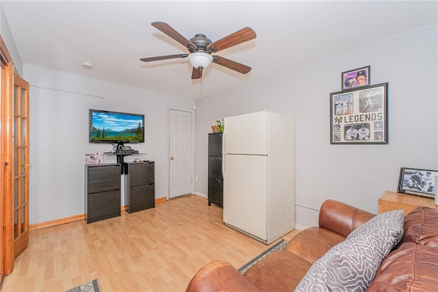 1960 Stillwell Ave, Brooklyn, NY 11223 - living area with light wood-style floors and ceiling fan
