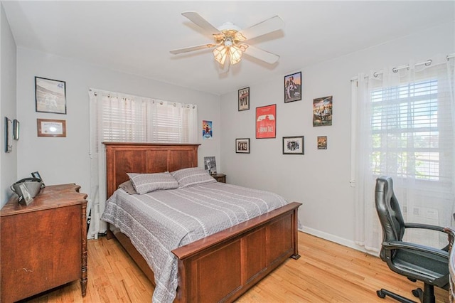 1960 Stillwell Ave, Brooklyn, NY 11223 - bedroom featuring light wood-type flooring, multiple windows, a desk, and a ceiling fan