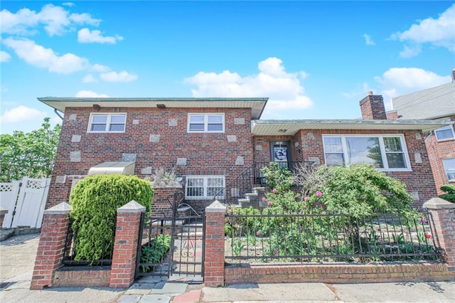 1960 Stillwell Ave, Brooklyn, NY 11223 - view of front facade with a fenced front yard, a gate, and brick siding