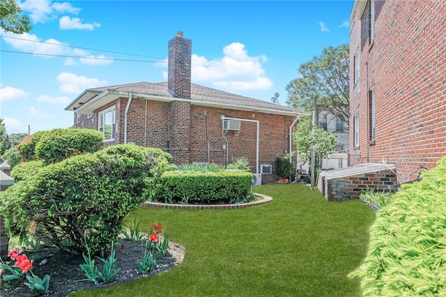 1960 Stillwell Ave, Brooklyn, NY 11223 - view of side of home featuring brick siding, a chimney, and a yard