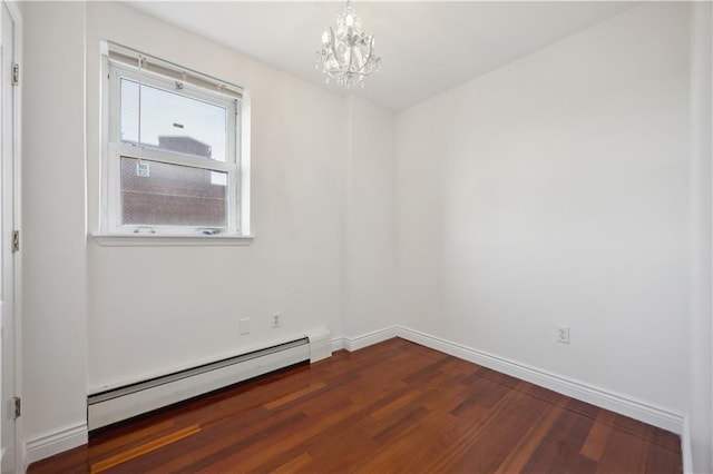 2408 Ocean Ave Unit 12, Brooklyn, NY 11229 - spare room featuring a baseboard heating unit, a chandelier, dark wood-style flooring, and baseboards