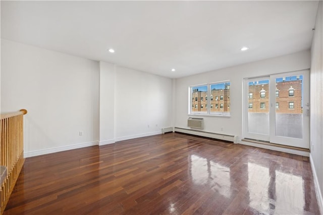interior space with recessed lighting, baseboards, baseboard heating, and wood finished floors