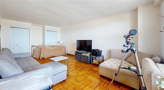 living room featuring a textured ceiling