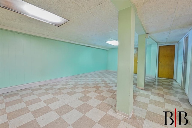 1265 E 92nd St, Brooklyn, NY 11236 - finished below grade area with light floors, a paneled ceiling, and baseboards