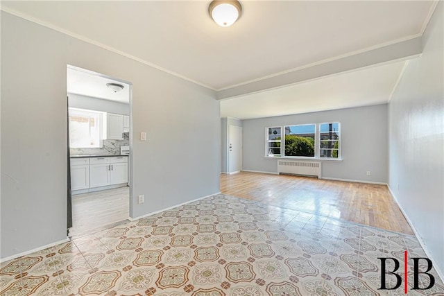 1265 E 92nd St, Brooklyn, NY 11236 - spare room with radiator, plenty of natural light, crown molding, baseboards, and light wood-style floors