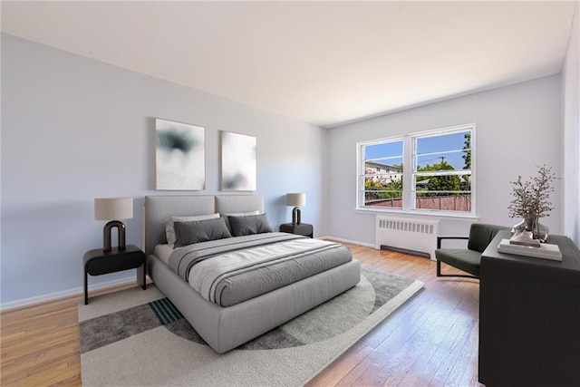 1265 E 92nd St, Brooklyn, NY 11236 - bedroom featuring radiator heating unit, hardwood / wood-style floors, and baseboards