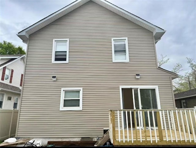 back of property featuring a deck