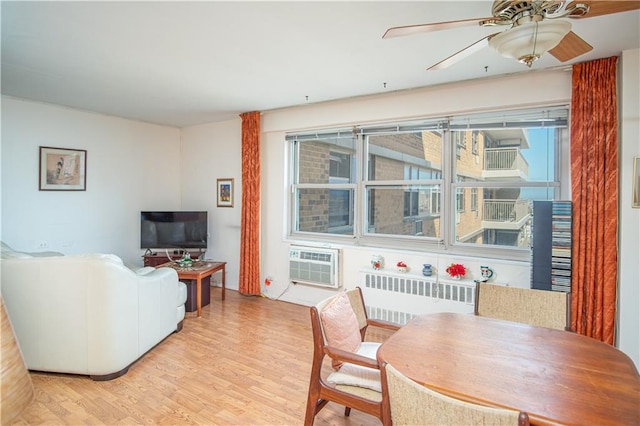 448 Neptune Ave Unit 19A, Brooklyn, NY 11224 - dining room with radiator heating unit, a ceiling fan, light wood-type flooring, and a wall mounted air conditioner