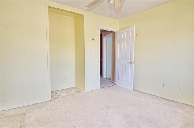 spare room with carpet flooring and ceiling fan