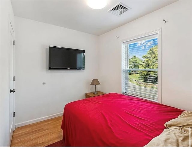 3626 Bayview Ave, Brooklyn, NY 11224 - bedroom with light wood-style floors and baseboards