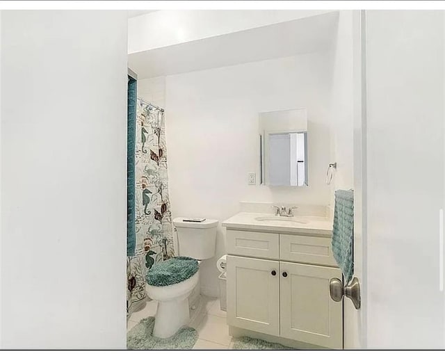 3626 Bayview Ave, Brooklyn, NY 11224 - bathroom featuring toilet, vanity, and tile patterned flooring