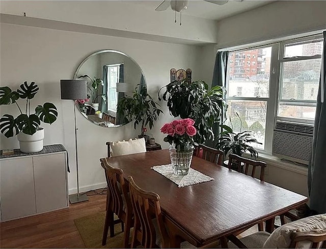 dining room with plenty of natural light, a ceiling fan, and wood finished floors