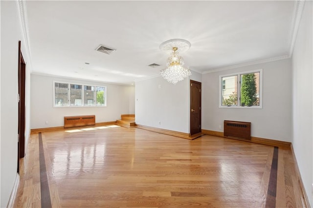 2680 E 23rd St, Brooklyn, NY 11235 - unfurnished living room featuring a chandelier, ornamental molding, light wood finished floors, and baseboards