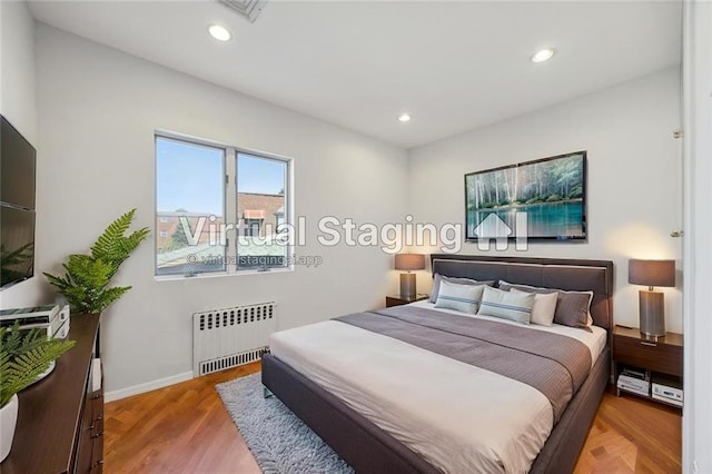 2680 E 23rd St, Brooklyn, NY 11235 - bedroom with radiator, recessed lighting, baseboards, and light wood-style flooring
