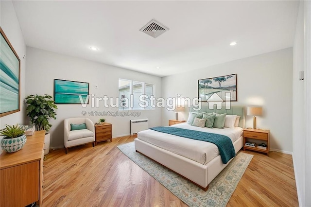 2680 E 23rd St, Brooklyn, NY 11235 - bedroom featuring radiator heating unit, light wood-style flooring, recessed lighting, and baseboards