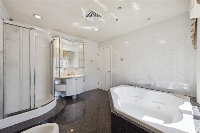 2680 E 23rd St, Brooklyn, NY 11235 - full bathroom featuring a shower stall, a jetted tub, vanity, tile walls, and recessed lighting