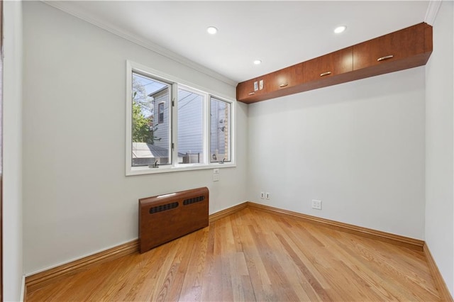 2680 E 23rd St, Brooklyn, NY 11235 - spare room with baseboards, ornamental molding, and light wood-style flooring
