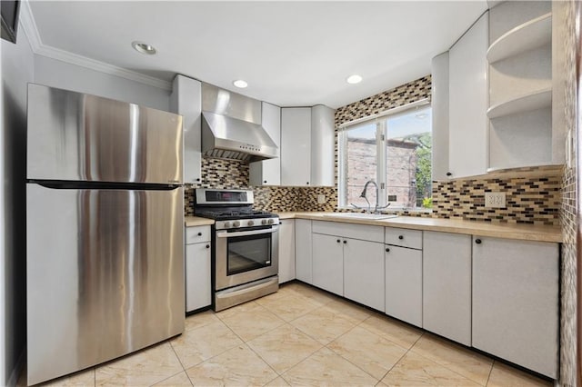 2680 E 23rd St, Brooklyn, NY 11235 - kitchen featuring appliances with stainless steel finishes, a sink, wall chimney range hood, light countertops, and ornamental molding