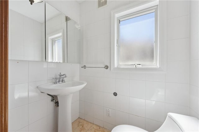 2680 E 23rd St, Brooklyn, NY 11235 - bathroom with tile walls and toilet