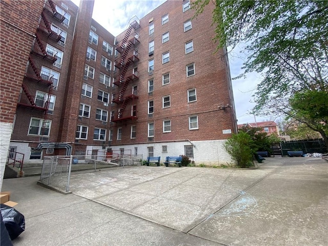 735 Avenue W Unit 1M, Brooklyn, NY 11223 - view of building exterior with fence