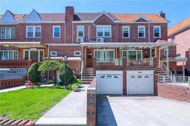 2046 Stuart St, Brooklyn, NY 11229 - multi unit property with concrete driveway, a chimney, brick siding, and an attached garage