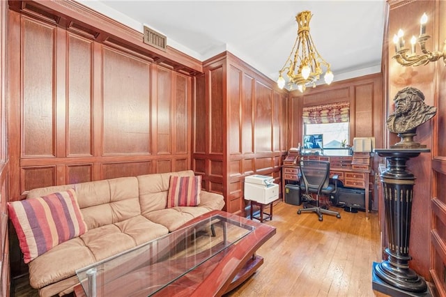 3821 Avenue S, Brooklyn, NY 11234 - office with light wood-type flooring, a chandelier, a decorative wall, and visible vents