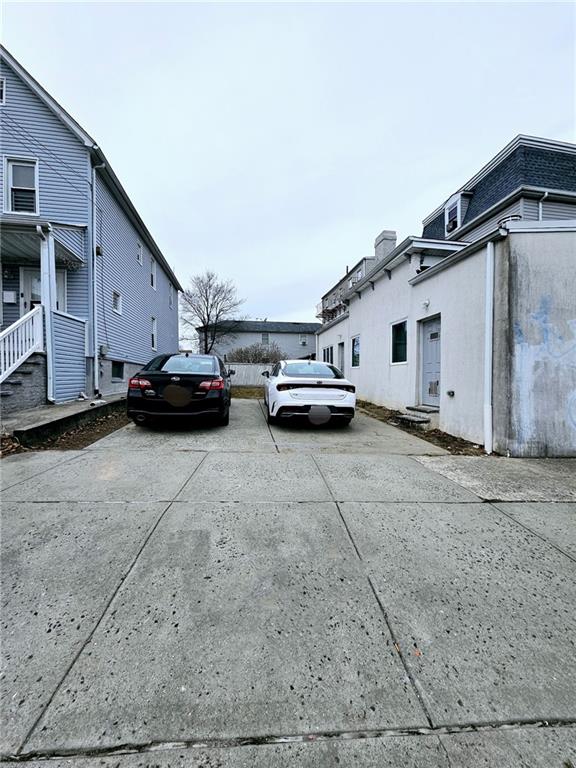 view of car parking featuring concrete driveway