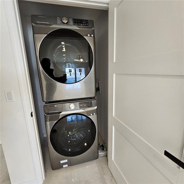 washroom with laundry area and stacked washer and clothes dryer