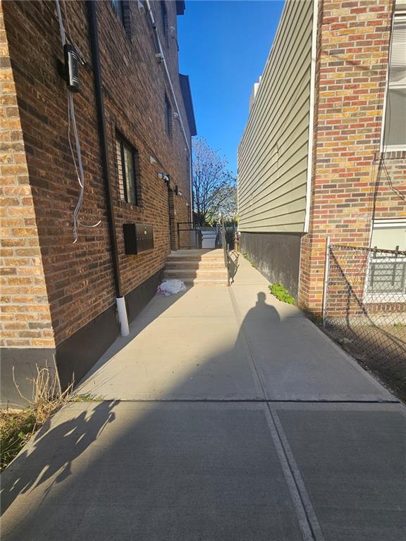 view of property exterior with brick siding
