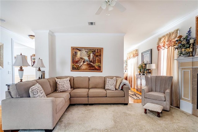 living room featuring crown molding, ceiling fan, and visible vents