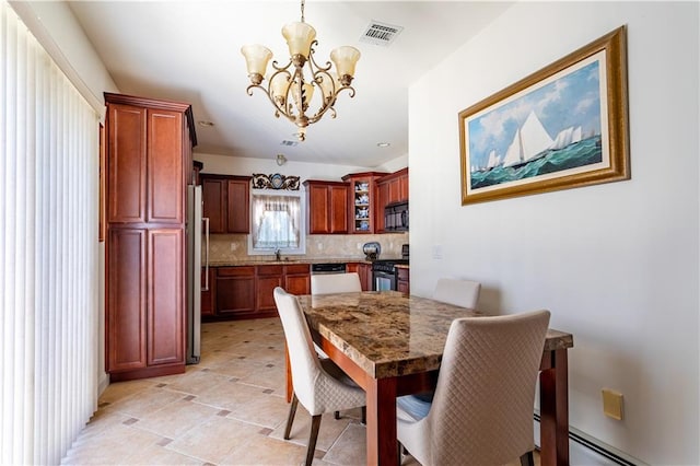 dining room featuring visible vents, a baseboard radiator, and a notable chandelier