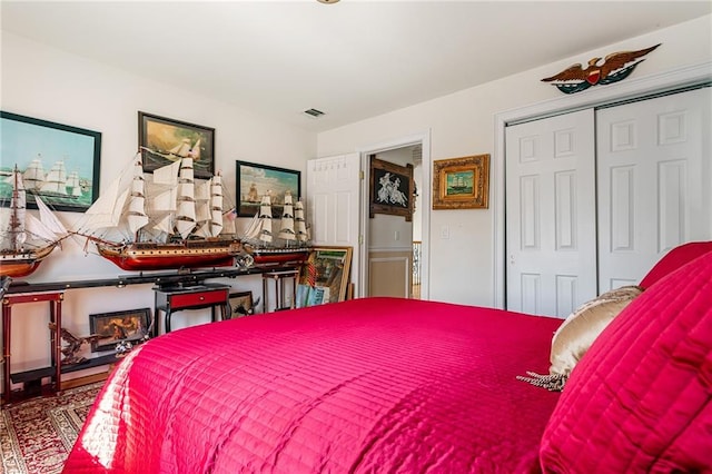 bedroom featuring a closet and visible vents