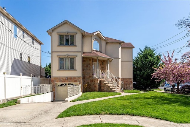 view of front facade featuring a garage, stucco siding, stone siding, and fence
