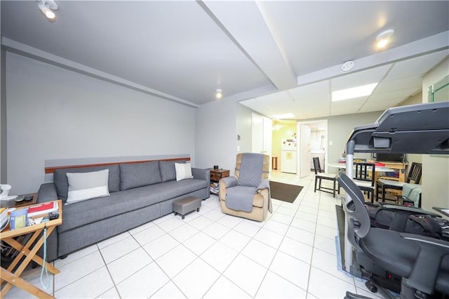 living room with washer / clothes dryer and light tile patterned floors