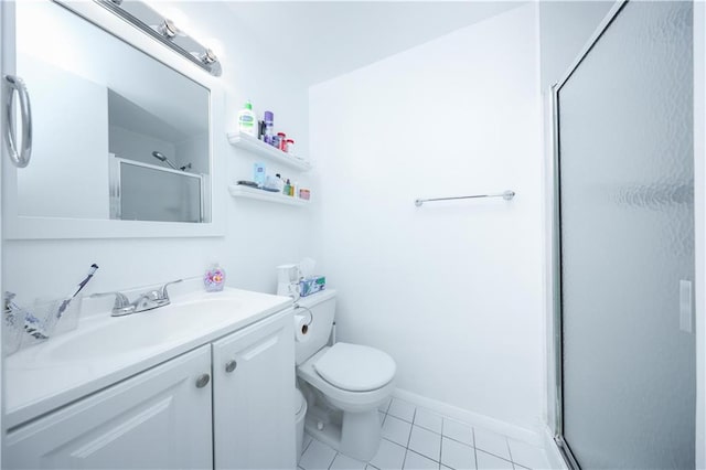 bathroom with vanity, toilet, tile patterned floors, baseboards, and a shower stall