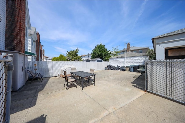 view of patio featuring outdoor dining space and a fenced backyard