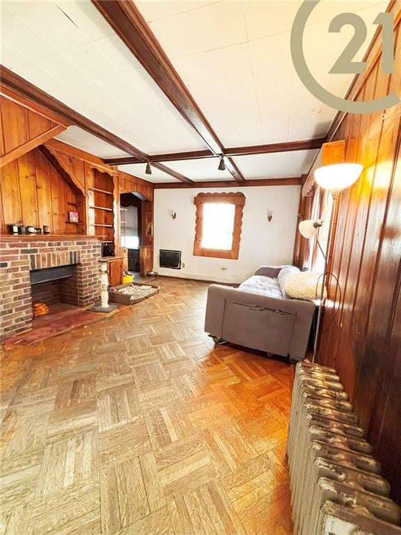 1817 E 15th St, Brooklyn, NY 11229 - living room with wooden walls and a brick fireplace