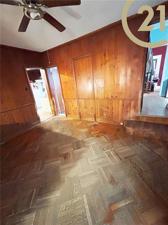 1817 E 15th St, Brooklyn, NY 11229 - unfurnished room with wooden walls and ceiling fan