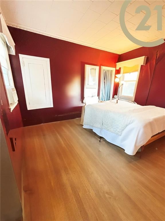 bedroom with wood finished floors