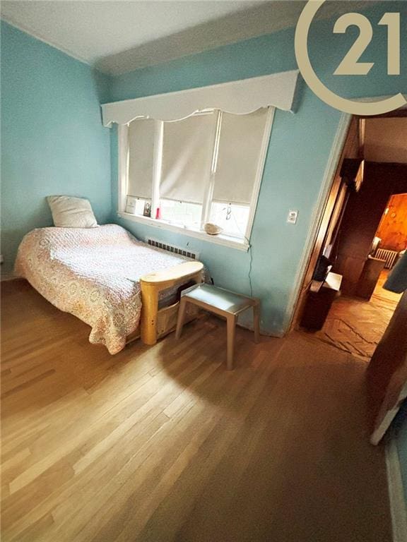 1817 E 15th St, Brooklyn, NY 11229 - bedroom featuring wood finished floors and radiator