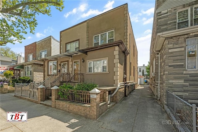 1854 73rd St, Brooklyn, NY 11204 - view of property featuring stucco siding