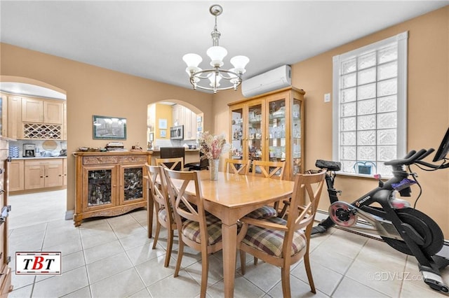 1854 73rd St, Brooklyn, NY 11204 - dining space with a wall mounted air conditioner, arched walkways, a chandelier, and light tile patterned floors